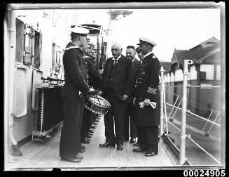 Man inspecting the crew of German cruiser KOLN at Circular Quay