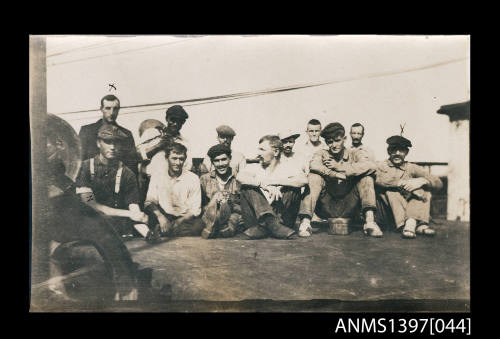 Photograph depicting a group of men posing for the camera