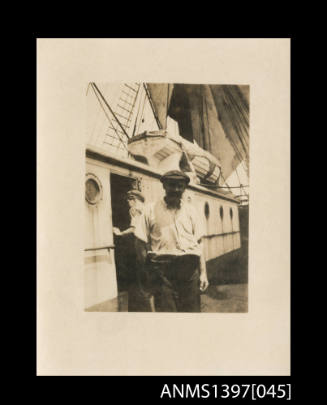 Photograph depicting a man on a ship's deck