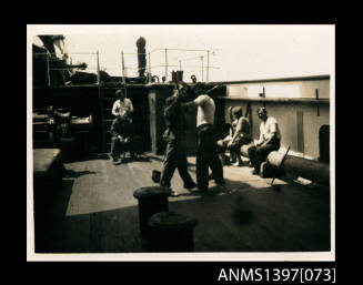 Photograph depicting a group of men on a ship's deck