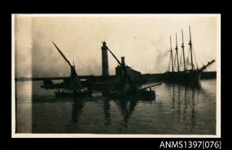 Photograph depicting a group of vessels at sea