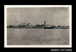 Photograph depicting a view of a ship at sea