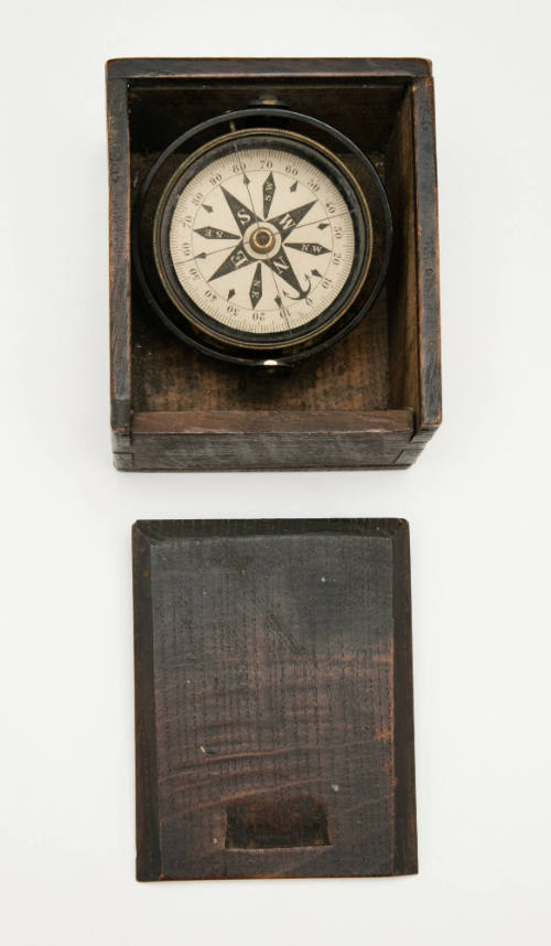 Boat compass with cardinal point markings and wooden box