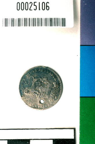 King George IV pierced sixpence, from the wreck of the DUNBAR