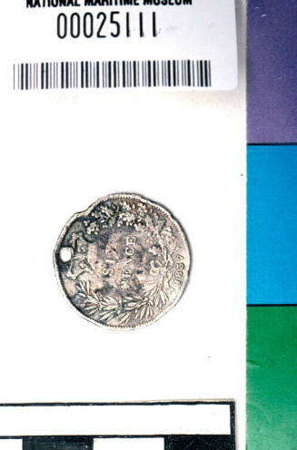 King William IV pierced sixpence, from the wreck of the DUNBAR