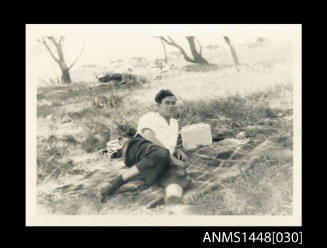 Man lying on a rug outdoors
