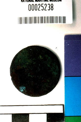 Corroded unidentified coin