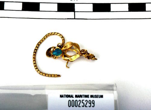 Gold brooch with chain recovered from the wreck of the DUNBAR