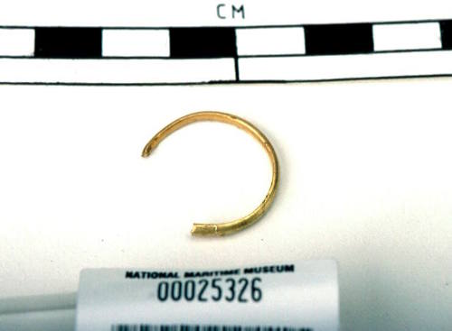 Partial gold ring recovered from the wreck of the DUNBAR