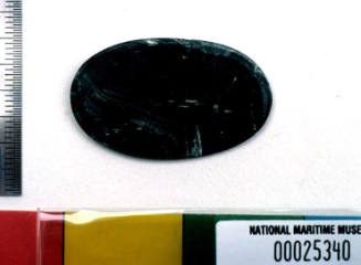 Black stone brooch setting recovered from the wreck of the DUNBAR