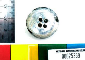 Mother of pearl button recovered from the wreck of the DUNBAR