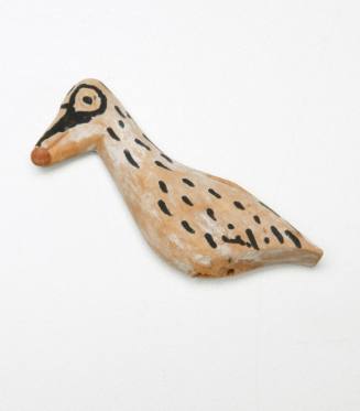 Wooden bird carving from model of five-part outrigger canoe