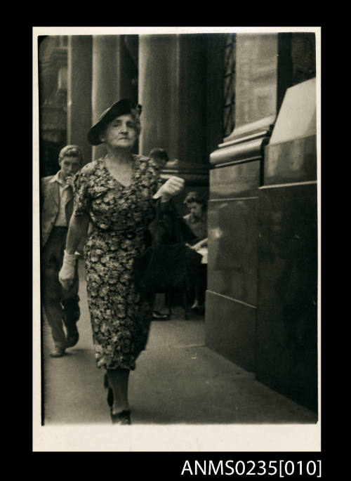 Muriel Binney walking past a Bank on George Street, Sydney