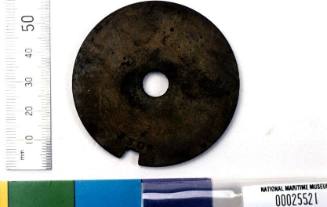 Clock barrel lid recovered from the wreck of the DUNBAR