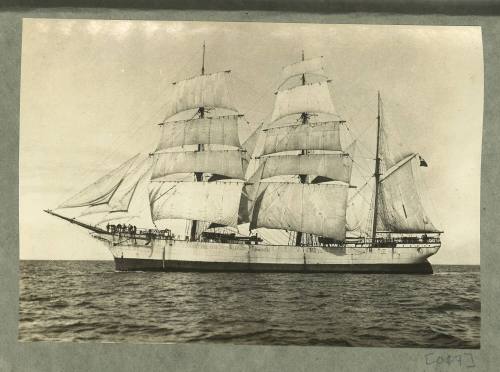 Full-rigged ship underway at sea