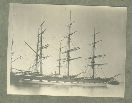 Barque docked at a wharf