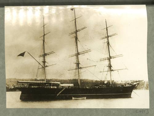 Full-rigged ship anchored in a harbour