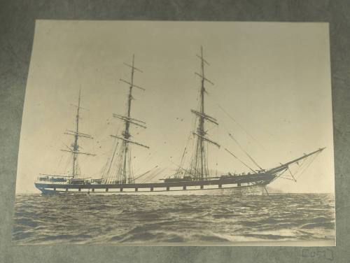 Full-rigged ship BRAMBLETYE anchored offshore.