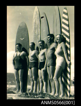 Five people standing infront of long surfboards, Victoria, Australia