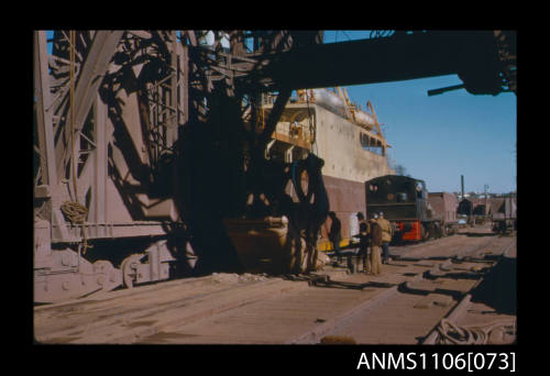 Colour photographic slide of iron ore unloading grabs Port Kembla