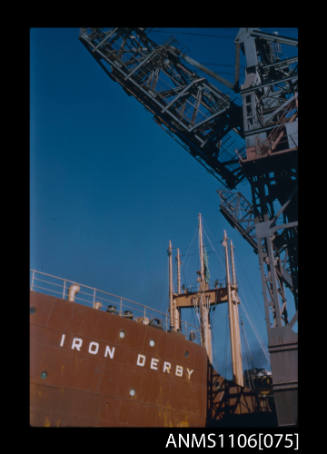 Colour photographic slide of iron ore unloaders and IRON DERBY