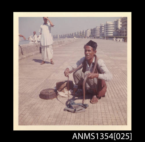 Photograph of a snake charmer in Colombo