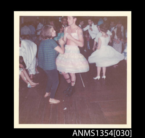 Photograph of a couple dancing at the Crossing the Line ceremony onboard SS STRATHEDEN