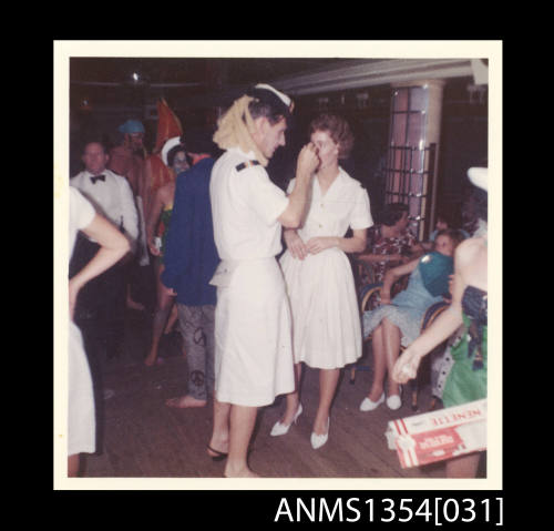 Photograph of an officer in a wig at the Crossing the Line ceremony onboard SS STRATHEDEN