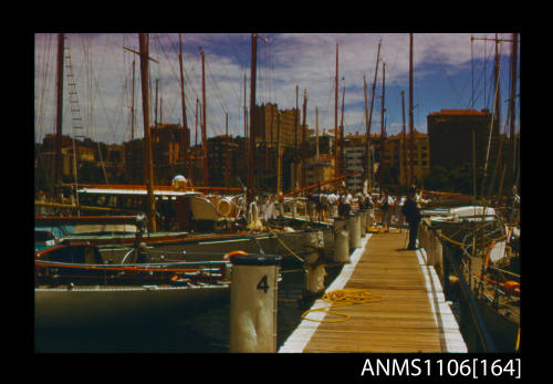 Colour photographic slide of yachts moored at Cruising Yacht Club wharf