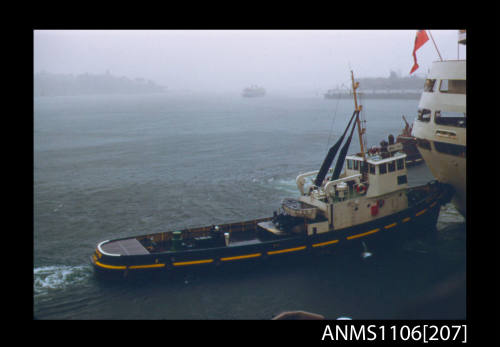 Colour photographic slide of tug SIRIUS COVE and CANBERRA