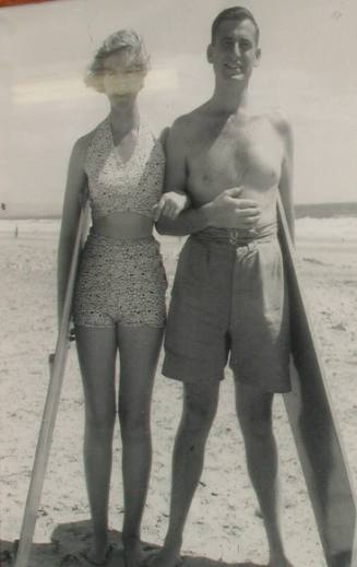 Jack Gaetjens and Bettine Mitchell with their surfboards