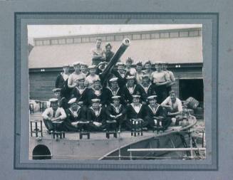 HMAS WARREGO sailors around the ship's gun