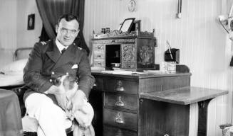 American ship's officer with pet dog