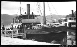 SS ERRINGHI moored at a wharf with people boarding