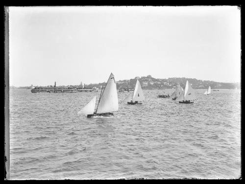 Sloop and ferries on Sydney Harbour