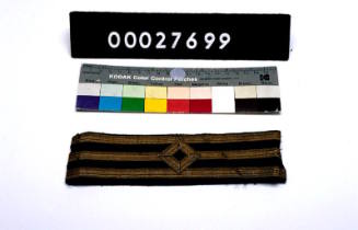 TWO PIECES OF FIRST OFFICER DISTINCTION LACE.  PART OF A TAILOR'S KIT, THE CASE 00027650, ITS CONTENTS REGISTERED AS 00027651 - 00027736.