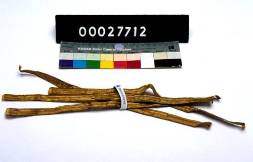 FOUR PIECES OF GOLD BRAID.  PART OF A TAILOR'S KIT, THE CASE 00027650, ITS CONTENTS REGISTERED AS 00027651 - 00027736.