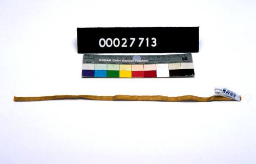 ONE PIECE OF GOLD BRAID.  PART OF A TAILOR'S KIT, THE CASE 00027650, ITS CONTENTS REGISTERED AS 00027651 - 00027736.