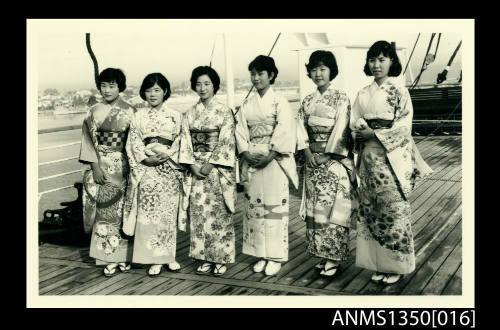 Five women in kimonos on a ships deck