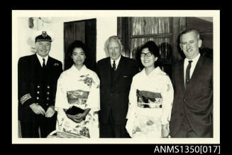 Captain Dun with two men and two women in kimonos