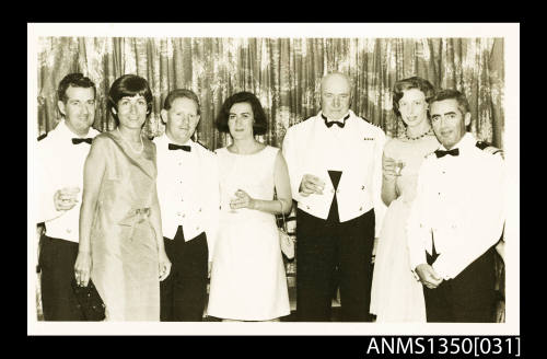 Image of group of people in dress uniform and formal dress