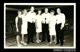 Image of group of people in dress uniform and formal dress