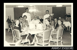 Image of group of people sitting around a table including Captain Dun