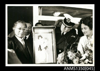 Captain Dun receiving framed Japanese print
