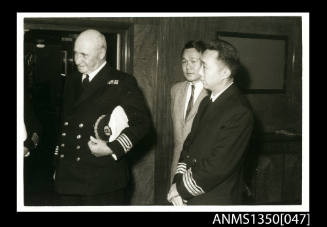 Captain Dun and two unidentified men