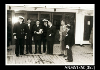 Captain Dun with group of unidentified men