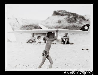 A very young Kevin Brennan about to enter the water at North Avalon NSW 1962