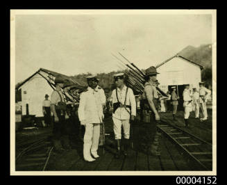 A contingent of the Australian Naval Expeditionary Force to New Guinea being inspected by a Japanese Admiral at Rabaul wharf in 1914