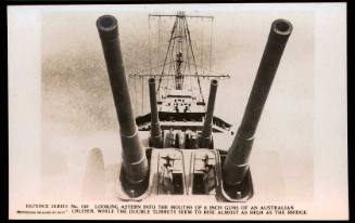 Defence Series No. 150 - Looking astern into the mouths of 6 inch guns of an Australian Cruiser while the double turrets seem to rise almost as high as the bridge