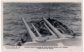 Defence Series No. 148 - Cruiser's bows dwarfed by this view of double gun turrets taken from the bridge